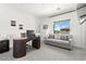 Bright office with a modern desk, comfortable seating, and natural light from the window at 295 Callen Falls Ave # 2225, Henderson, NV 89011