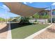 Shaded community playground featuring modern equipment, green turf, and landscaping at 295 Callen Falls Ave # 2225, Henderson, NV 89011