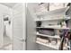Well-organized storage closet with ample shelving for linens and household items at 295 Callen Falls Ave # 2225, Henderson, NV 89011