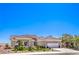 Beautiful single-story home featuring mature landscaping, a three-car garage and a tile roof at 3028 Treesdale Dr, Las Vegas, NV 89134