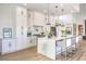 Well-designed kitchen with white cabinets, a large center island, and modern stainless steel appliances at 3028 Treesdale Dr, Las Vegas, NV 89134