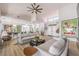 Open-concept living area boasting a large window, fireplace, and seamless flow to the kitchen at 3028 Treesdale Dr, Las Vegas, NV 89134