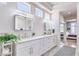 Elegant primary bathroom with dual sinks, marble countertops, and stylish fixtures at 3028 Treesdale Dr, Las Vegas, NV 89134
