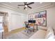 Bright office space with neutral decor, modern ceiling fan, and Disney art at 3028 Treesdale Dr, Las Vegas, NV 89134
