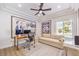 Bright office space with neutral decor, modern ceiling fan, and Disney art at 3028 Treesdale Dr, Las Vegas, NV 89134