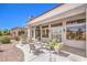 Relaxing covered patio with outdoor seating and built-in grill, great for enjoying outdoor living and entertaining at 3028 Treesdale Dr, Las Vegas, NV 89134