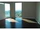 Bright bedroom with hardwood floors and stunning views from the large windows at 322 Karen Ave # 2606, Las Vegas, NV 89109