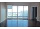 Spacious living room with hardwood floors and sliding glass doors at 322 Karen Ave # 2606, Las Vegas, NV 89109