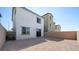This backyard has brick walls on the side, gravel, and sliding doors to the house at 336 Taylor St, Henderson, NV 89015