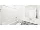 Pristine bathroom with a shower-tub combo, white subway tile, and a single sink vanity at 336 Taylor St, Henderson, NV 89015