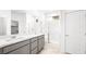 Bathroom with double vanity, quartz countertop, and glass-enclosed shower at 336 Taylor St, Henderson, NV 89015