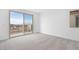 This bedroom has plush carpet and a large sliding glass door to a balcony at 336 Taylor St, Henderson, NV 89015