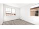 This bedroom has neutral paint, carpeted floors and two bright windows to let in the sunlight at 336 Taylor St, Henderson, NV 89015