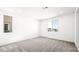 Bright bedroom features plush carpeting, recessed lighting, and two windows at 336 Taylor St, Henderson, NV 89015