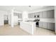 Gorgeous kitchen featuring gray cabinets, a kitchen island, and stainless steel appliances at 336 Taylor St, Henderson, NV 89015