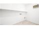 Efficient laundry room with tile flooring, utility connections, and a shelf at 336 Taylor St, Henderson, NV 89015