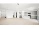 Large living space with wood-look floors and views into the open kitchen and backyard at 336 Taylor St, Henderson, NV 89015