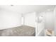 Spacious loft area with plush gray carpeting and natural light from a window at 336 Taylor St, Henderson, NV 89015