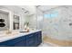 Modern bathroom with marble shower, double sinks, and elegant vanity at 338 Taylor St, Henderson, NV 89015