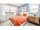 Charming bedroom with blue wall, white trimmings, and orange accents at 338 Taylor St, Henderson, NV 89015