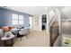 An open bonus room with stairs, banquette, and views to laundry room at 338 Taylor St, Henderson, NV 89015