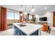 Open-concept kitchen featuring a large island, pendant lighting, and modern appliances at 338 Taylor St, Henderson, NV 89015