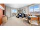 Bright living room with view of mountain, neutral walls, modern furniture, and balcony access at 338 Taylor St, Henderson, NV 89015