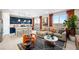 Open-concept living space with a modern kitchen, comfy sofa, and ample natural light at 338 Taylor St, Henderson, NV 89015
