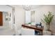 Bright office space with modern desk, chairs, stylish light fixture, and indoor greenery at 338 Taylor St, Henderson, NV 89015