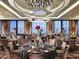 Elegant banquet hall featuring round tables with floral centerpieces under crystal chandeliers for a luxe event at 3750 S Las Vegas Blvd # 3111, Las Vegas, NV 89158