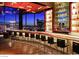 Upscale bar featuring city views, counter seating, and backlit shelving to create a luxurious nightlife experience at 3750 S Las Vegas Blvd # 3111, Las Vegas, NV 89158