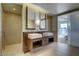 Modern bathroom with floating double vanity with unique wood accents, square vessel sinks, and luxurious glass-enclosed shower at 3750 S Las Vegas Blvd # 3111, Las Vegas, NV 89158