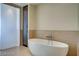 A contemporary bathroom featuring a sleek soaking tub with modern fixtures and a glass-enclosed shower, all designed for relaxation at 3750 S Las Vegas Blvd # 3111, Las Vegas, NV 89158