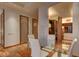 Dining area showcases a glass table with seating for four, with a partial view into the kitchen at 3750 S Las Vegas Blvd # 3111, Las Vegas, NV 89158
