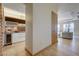 Hallway view includes modern kitchen, hardwood floors and a comfortable living room with floor to ceiling windows at 3750 S Las Vegas Blvd # 3111, Las Vegas, NV 89158