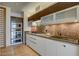 Modern kitchen features stainless steel appliances, dark wood accents and stylish under cabinet lighting at 3750 S Las Vegas Blvd # 3111, Las Vegas, NV 89158