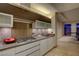 This modern kitchen features stainless appliances, stone backsplash and a view to the living room at 3750 S Las Vegas Blvd # 3111, Las Vegas, NV 89158