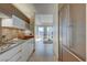 Modern kitchen with stainless appliances and stone backsplash, flows into a living area with city views at 3750 S Las Vegas Blvd # 3111, Las Vegas, NV 89158