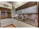 This modern kitchen features stainless steel appliances, dark wood accents and a stone backsplash at 3750 S Las Vegas Blvd # 3111, Las Vegas, NV 89158
