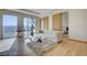 Bright living room features comfortable sofa, floor to ceiling windows and sliding doors, revealing the bedroom at 3750 S Las Vegas Blvd # 3111, Las Vegas, NV 89158