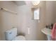 Simple half-bathroom featuring a pedestal sink, toilet, and neutral wall color at 3950 S Sandhill Rd # 130, Las Vegas, NV 89121