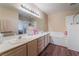 Bathroom with a white shower, white tile, a soaking tub, a double vanity, and wood floor at 3950 S Sandhill Rd # 130, Las Vegas, NV 89121
