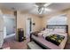Comfortable bedroom, with a glimpse into the entryway, complete with neutral carpet and walls at 3950 S Sandhill Rd # 130, Las Vegas, NV 89121