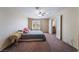 Bright bedroom with carpet flooring, ceiling fan and window offers comfortable living at 3950 S Sandhill Rd # 130, Las Vegas, NV 89121