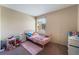 Comfortable bedroom with window, carpet, and furniture offers relaxing living space at 3950 S Sandhill Rd # 130, Las Vegas, NV 89121