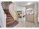 Entryway with carpeted stairs leading to the upper level and tile flooring at 3950 S Sandhill Rd # 130, Las Vegas, NV 89121