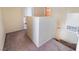 Carpeted stairway leading to the upper level of the home, with neutral-colored walls at 3950 S Sandhill Rd # 130, Las Vegas, NV 89121