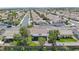 Expansive aerial view of a desert community boasting beautiful homes and well-maintained streets under a clear sky at 401 Obsidian St, Las Vegas, NV 89145