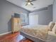Bright bedroom with natural light, hardwood floors, and neutral wall coloring at 401 Obsidian St, Las Vegas, NV 89145