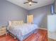 Charming bedroom with ceiling fan, neutral walls, and hardwood style flooring at 401 Obsidian St, Las Vegas, NV 89145